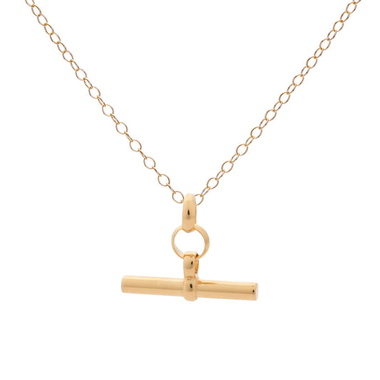 Gold necklace with a t-bar pendant on a white background