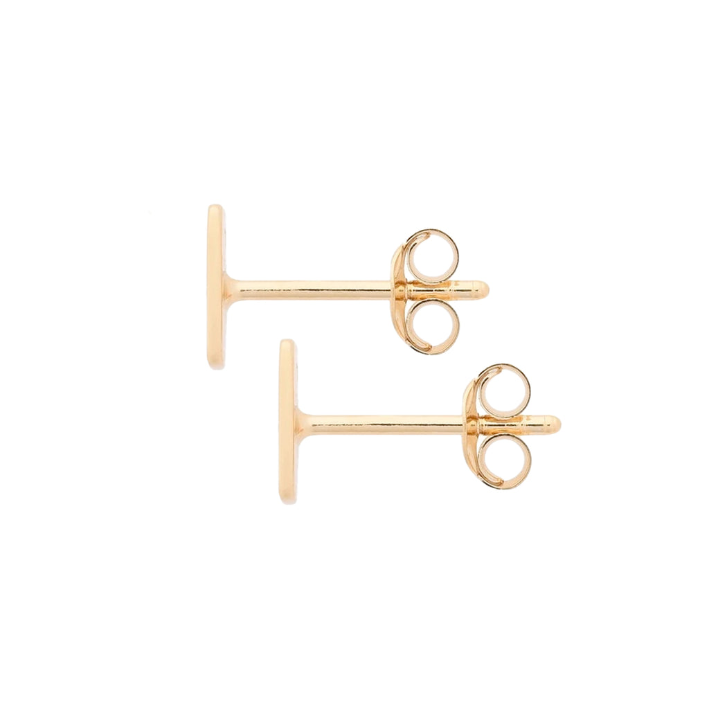 Pair of gold stud earrings on a white background