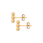 Pair of gold bubble stud earrings on a white background